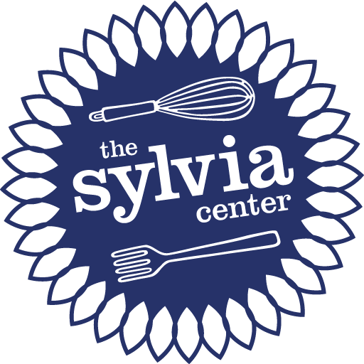 Sylvia Center Incorporated logo